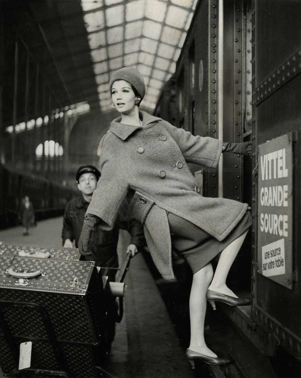 © Estate of Louis Faurer, Model hanging out of Train Car, Paris, 1960